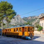 Bunyola, Spain - October 21, 2021: Ancient train Tren de Soller public transport transit transportation railway on Mallorca in Bunyola, Spain.